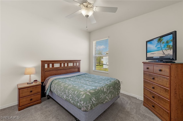 carpeted bedroom featuring ceiling fan and baseboards