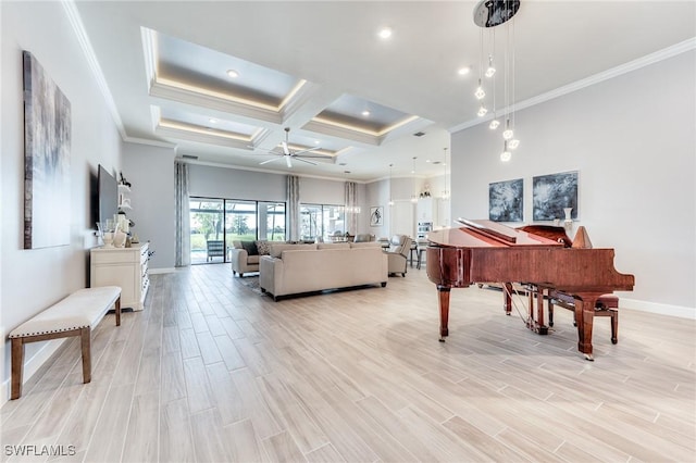 living area featuring baseboards, wood finish floors, a ceiling fan, and crown molding