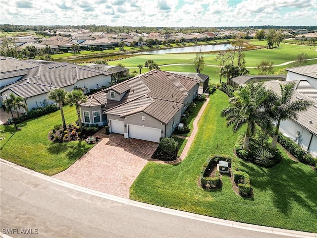 bird's eye view featuring a water view, view of golf course, and a residential view