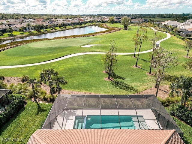 aerial view featuring a residential view, a water view, and golf course view