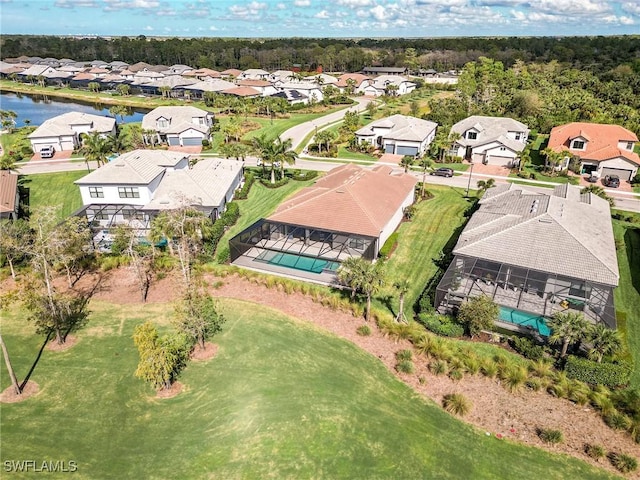 bird's eye view with a residential view and a water view