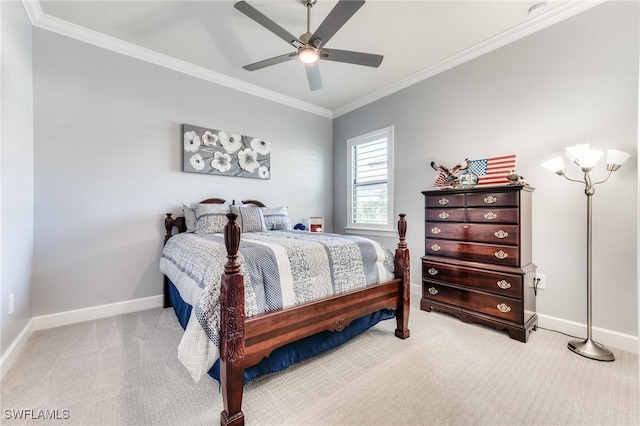 bedroom with a ceiling fan, light carpet, crown molding, and baseboards