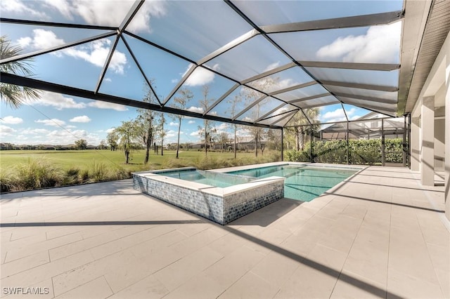 view of swimming pool with a pool with connected hot tub, a patio area, a lawn, and a lanai