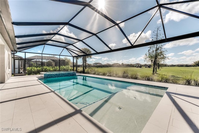 view of swimming pool with a patio, a lanai, and a pool with connected hot tub