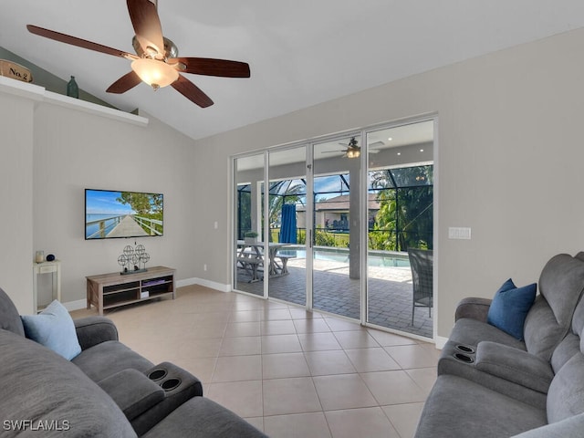 living area with lofted ceiling, light tile patterned flooring, a sunroom, and baseboards