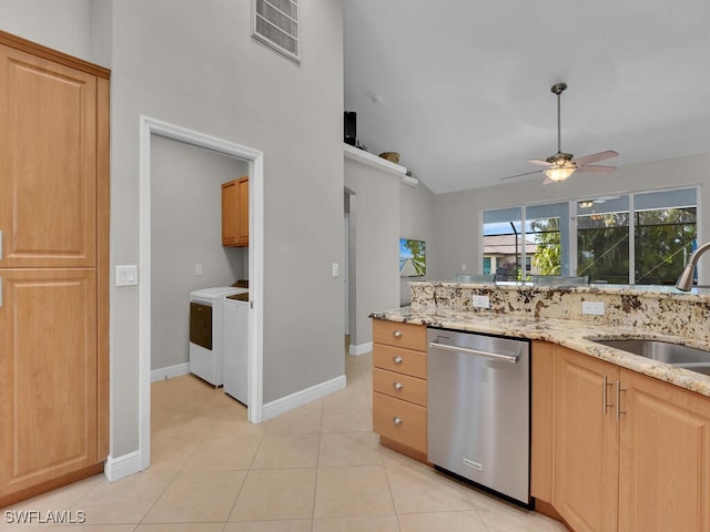 kitchen with washer and clothes dryer, visible vents, light tile patterned flooring, a sink, and dishwasher