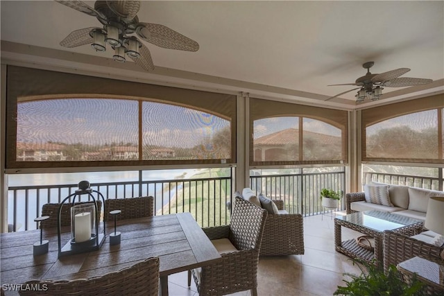 sunroom with a ceiling fan