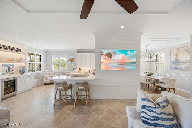 interior space featuring light tile patterned floors, wine cooler, recessed lighting, beam ceiling, and crown molding