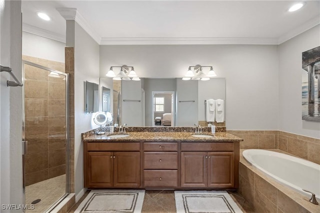 bathroom featuring a stall shower, tile patterned floors, crown molding, and a bath