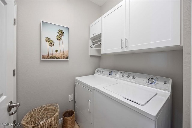 laundry area with cabinet space and washer and clothes dryer