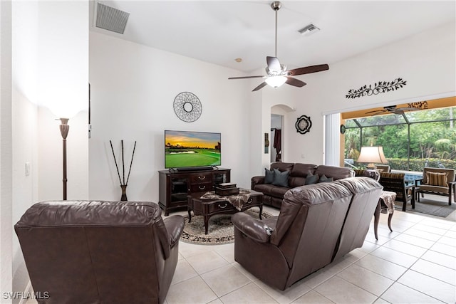12020 Bramble Cove Dr, Fort Myers, FL 33905 - living room featuring arched walkways, a ceiling fan, visible vents, and light tile patterned floors