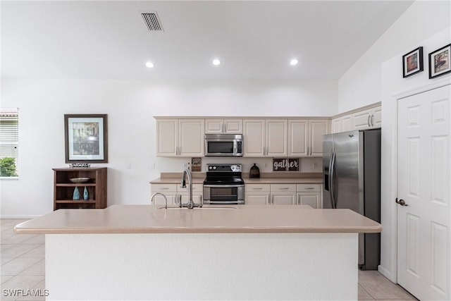 12020 Bramble Cove Dr, Fort Myers, FL 33905 - kitchen with light countertops, light tile patterned flooring, stainless steel appliances, and visible vents