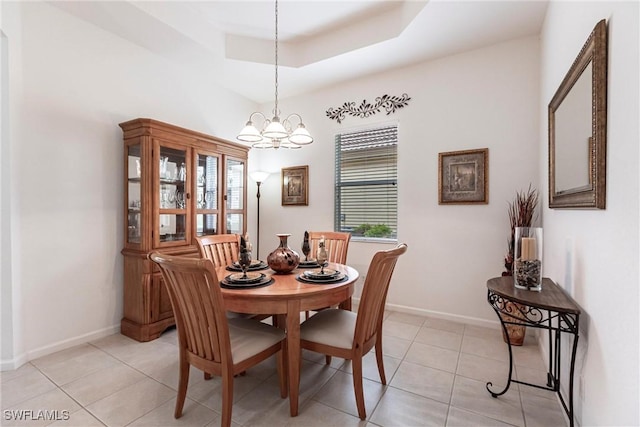 12020 Bramble Cove Dr, Fort Myers, FL 33905 - dining room with light tile patterned flooring, baseboards, an inviting chandelier, and a raised ceiling