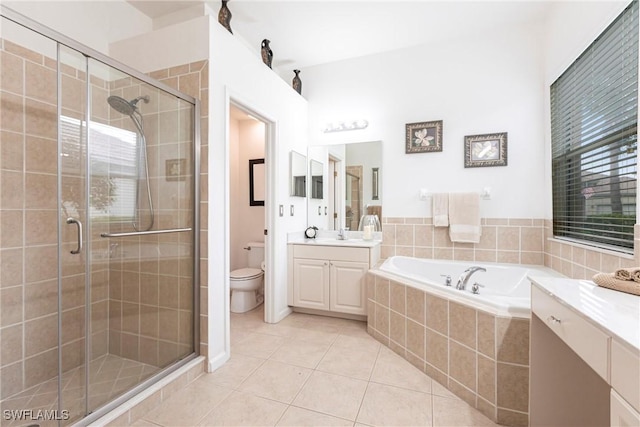 12020 Bramble Cove Dr, Fort Myers, FL 33905 - full bath featuring a bath, a shower stall, toilet, tile patterned floors, and vanity