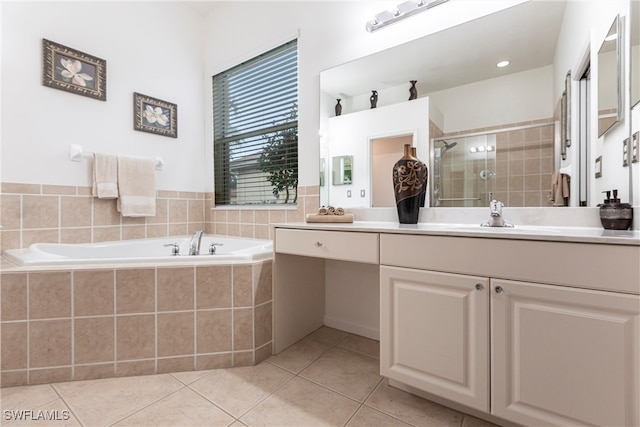 12020 Bramble Cove Dr, Fort Myers, FL 33905 - bathroom with tile patterned floors, vanity, a stall shower, and a garden tub