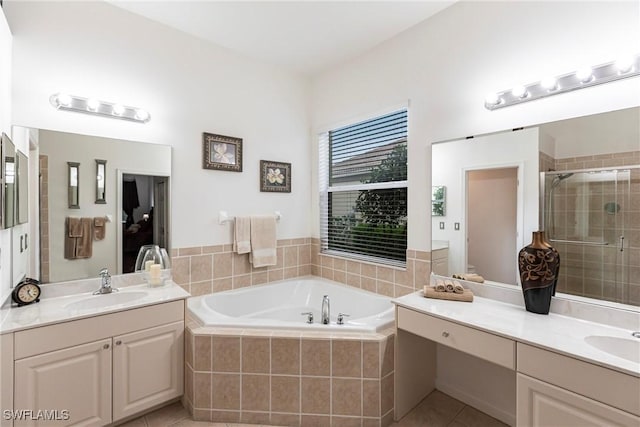 12020 Bramble Cove Dr, Fort Myers, FL 33905 - bathroom with a garden tub, a sink, a stall shower, and two vanities