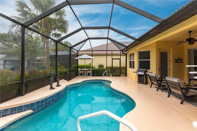 12020 Bramble Cove Dr, Fort Myers, FL 33905 - pool with area for grilling, glass enclosure, ceiling fan, and a patio area