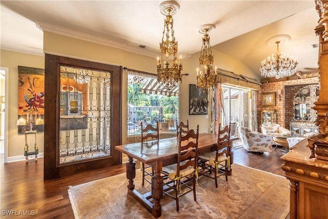 834 Coldstream Ct, Naples, FL 34104 - dining area featuring a chandelier, hardwood / wood-style floors, vaulted ceiling, and crown molding