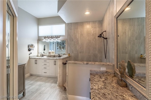 834 Coldstream Ct, Naples, FL 34104 - full bath with a tile shower and double vanity