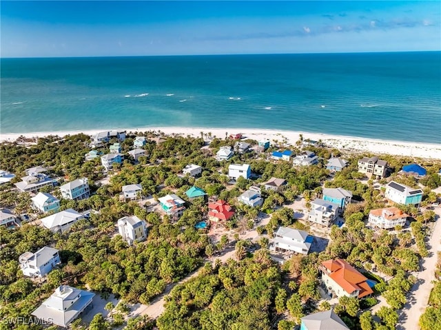 bird's eye view featuring a water view and a view of the beach