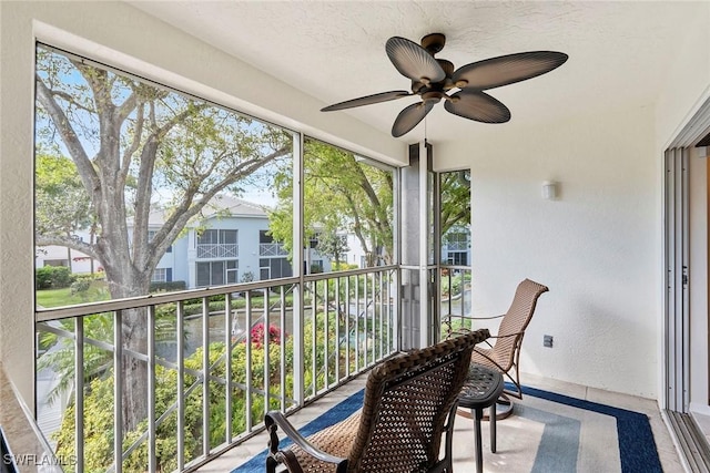 balcony with a sunroom and ceiling fan