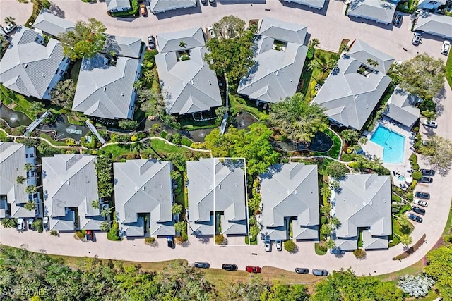 aerial view of residential area featuring a pool