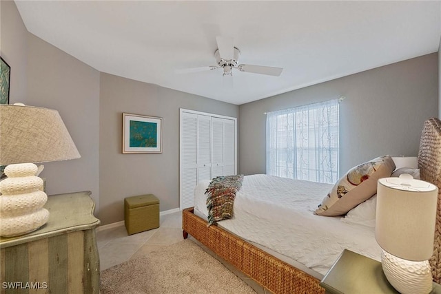 7070 Barrington Cir Unit 202, Naples, FL 34108 - bedroom with carpet, a closet, baseboards, and ceiling fan
