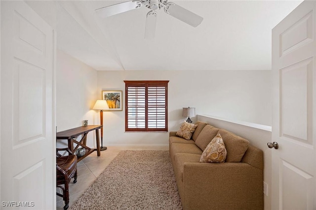 7070 Barrington Cir Unit 202, Naples, FL 34108 - living room with a ceiling fan, lofted ceiling, light tile patterned floors, and baseboards
