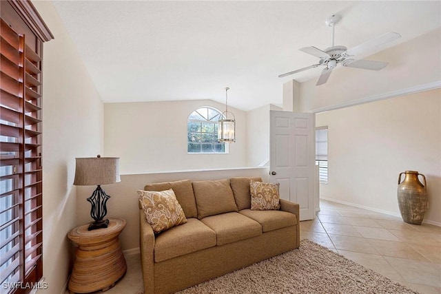 7070 Barrington Cir Unit 202, Naples, FL 34108 - living area featuring vaulted ceiling, light tile patterned flooring, a ceiling fan, a chandelier, and baseboards