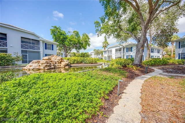 7070 Barrington Cir Unit 202, Naples, FL 34108 - view of yard featuring a water view