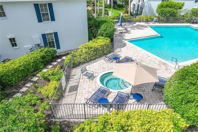7070 Barrington Cir Unit 202, Naples, FL 34108 - community pool featuring a patio area and a hot tub