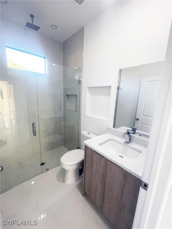 full bath with toilet, visible vents, a stall shower, and vanity