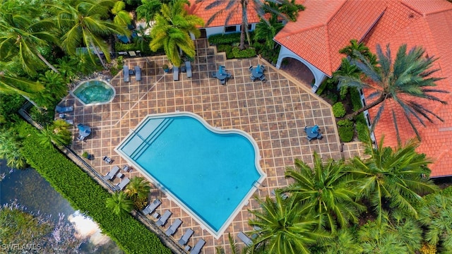 view of swimming pool with a patio area
