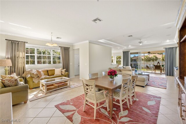 dining room featuring ornamental molding, a wealth of natural light, visible vents, and light tile patterned floors