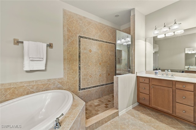 full bath featuring tile patterned floors, a walk in shower, vanity, and a bath