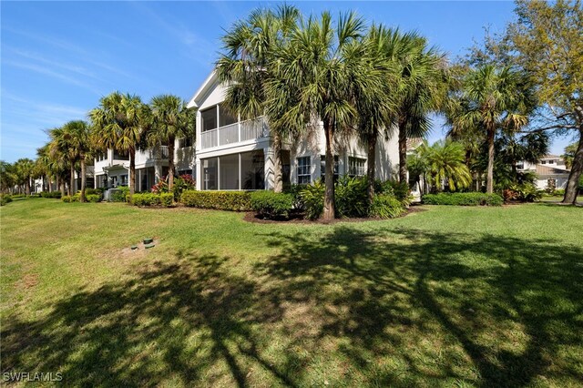 view of yard with a sunroom