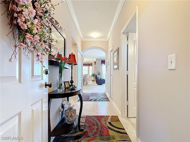 8096 Queen Palm Ln Unit 227, Fort Myers, FL 33966 - hallway featuring light tile patterned floors, baseboards, arched walkways, and ornamental molding