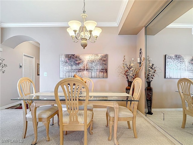 8096 Queen Palm Ln Unit 227, Fort Myers, FL 33966 - dining room with ornamental molding, arched walkways, an inviting chandelier, baseboards, and light colored carpet
