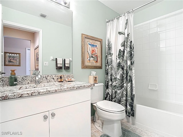 8096 Queen Palm Ln Unit 227, Fort Myers, FL 33966 - bathroom featuring visible vents, shower / bath combo with shower curtain, toilet, and vanity