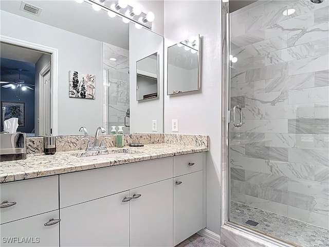 8096 Queen Palm Ln Unit 227, Fort Myers, FL 33966 - full bath featuring vanity, a ceiling fan, visible vents, and a stall shower
