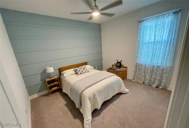 bedroom featuring ceiling fan and light colored carpet