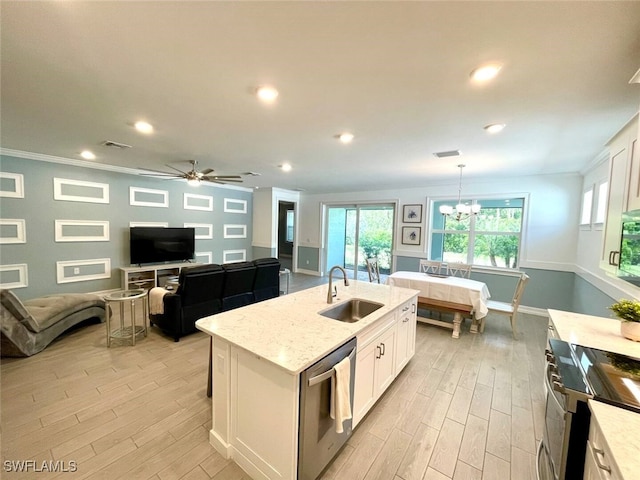 kitchen featuring visible vents, stainless steel dishwasher, white cabinetry, a sink, and light wood-type flooring