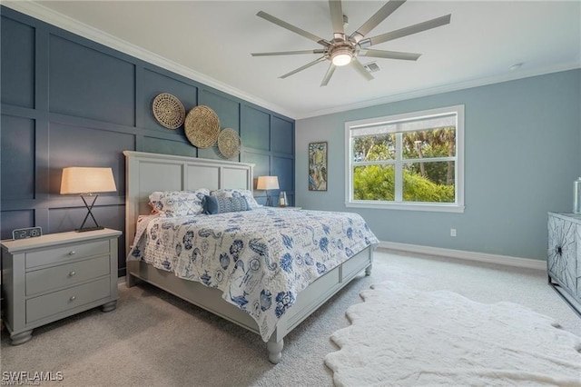 bedroom with light carpet, ornamental molding, visible vents, and a decorative wall