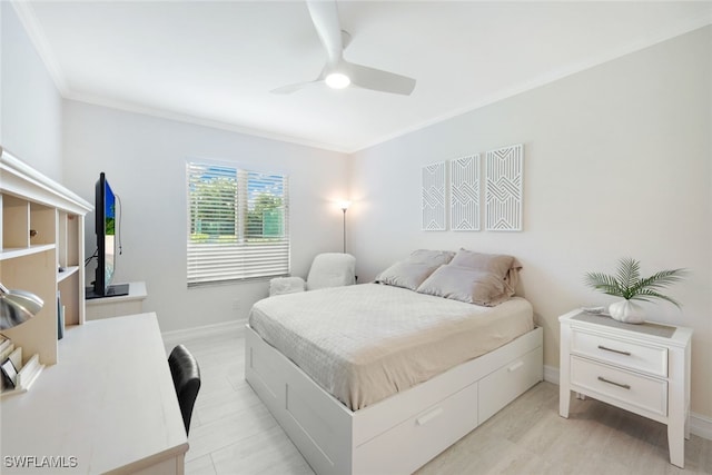 bedroom featuring ornamental molding, a ceiling fan, and baseboards