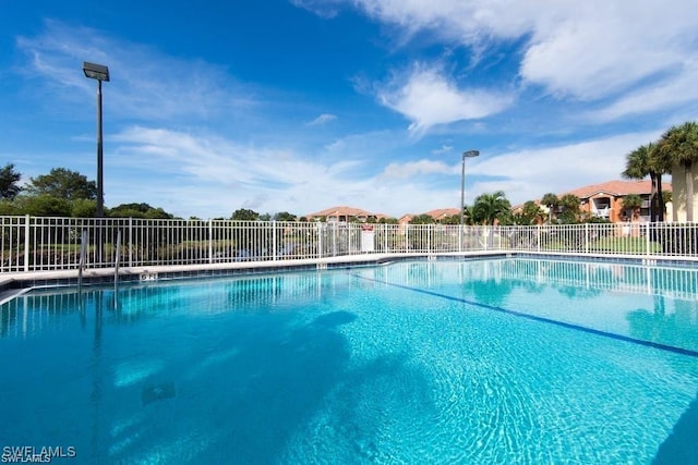 community pool featuring fence