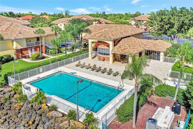 pool featuring a residential view and a fenced backyard