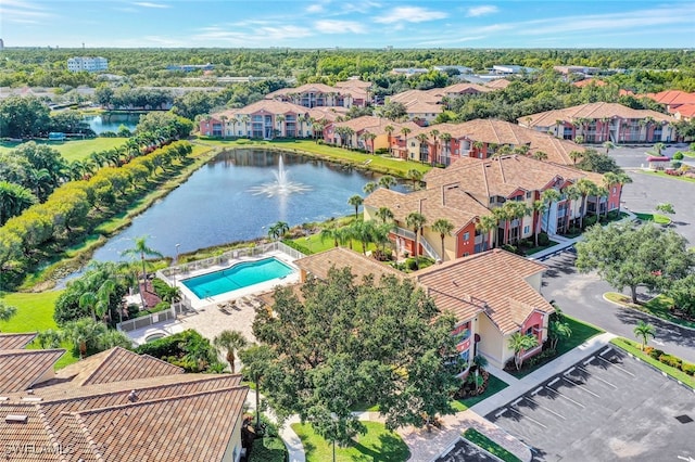 bird's eye view featuring a residential view and a water view