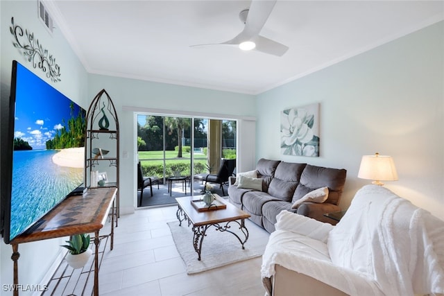 living room featuring ceiling fan, visible vents, and ornamental molding