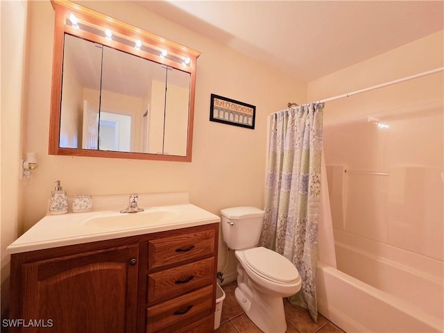 bathroom featuring tile patterned flooring, vanity, toilet, and shower / bath combo with shower curtain