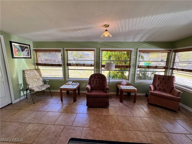 sunroom / solarium featuring a healthy amount of sunlight